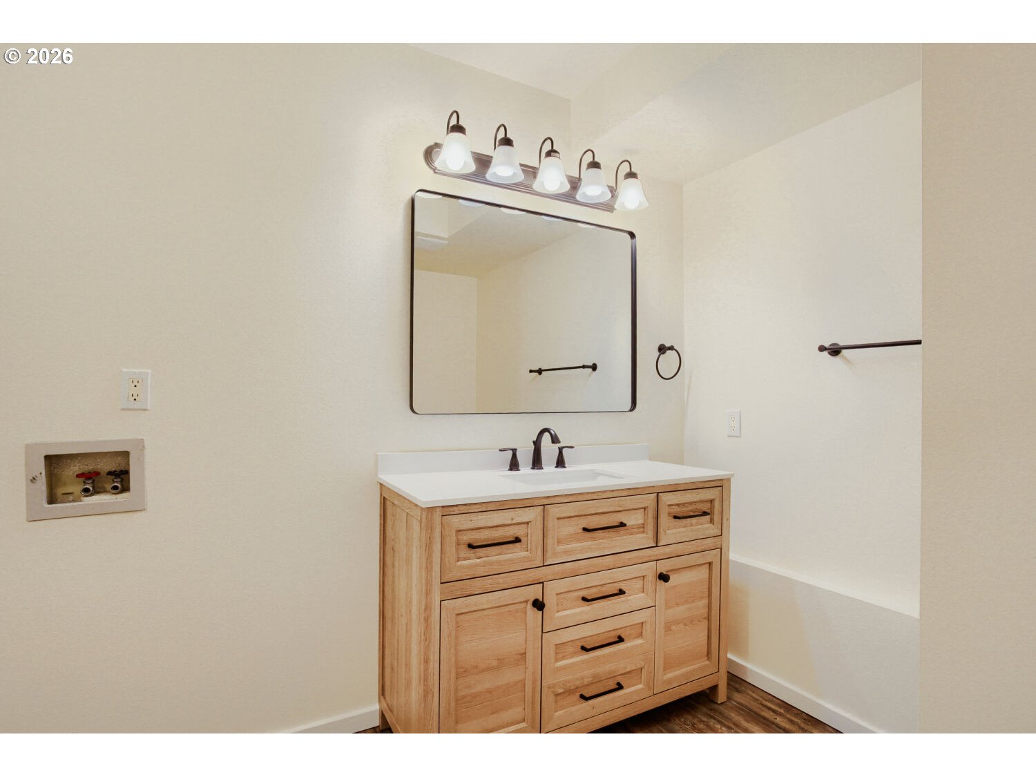 14539 Southeast Center Street Portland, OR 97236 - Photo 23 of 30 a bathroom with a sink vanity and mirror