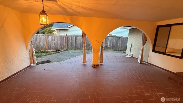 a close view of a sink a counter space and utility room