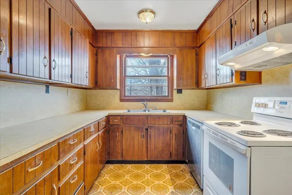 a kitchen with a cabinets and window