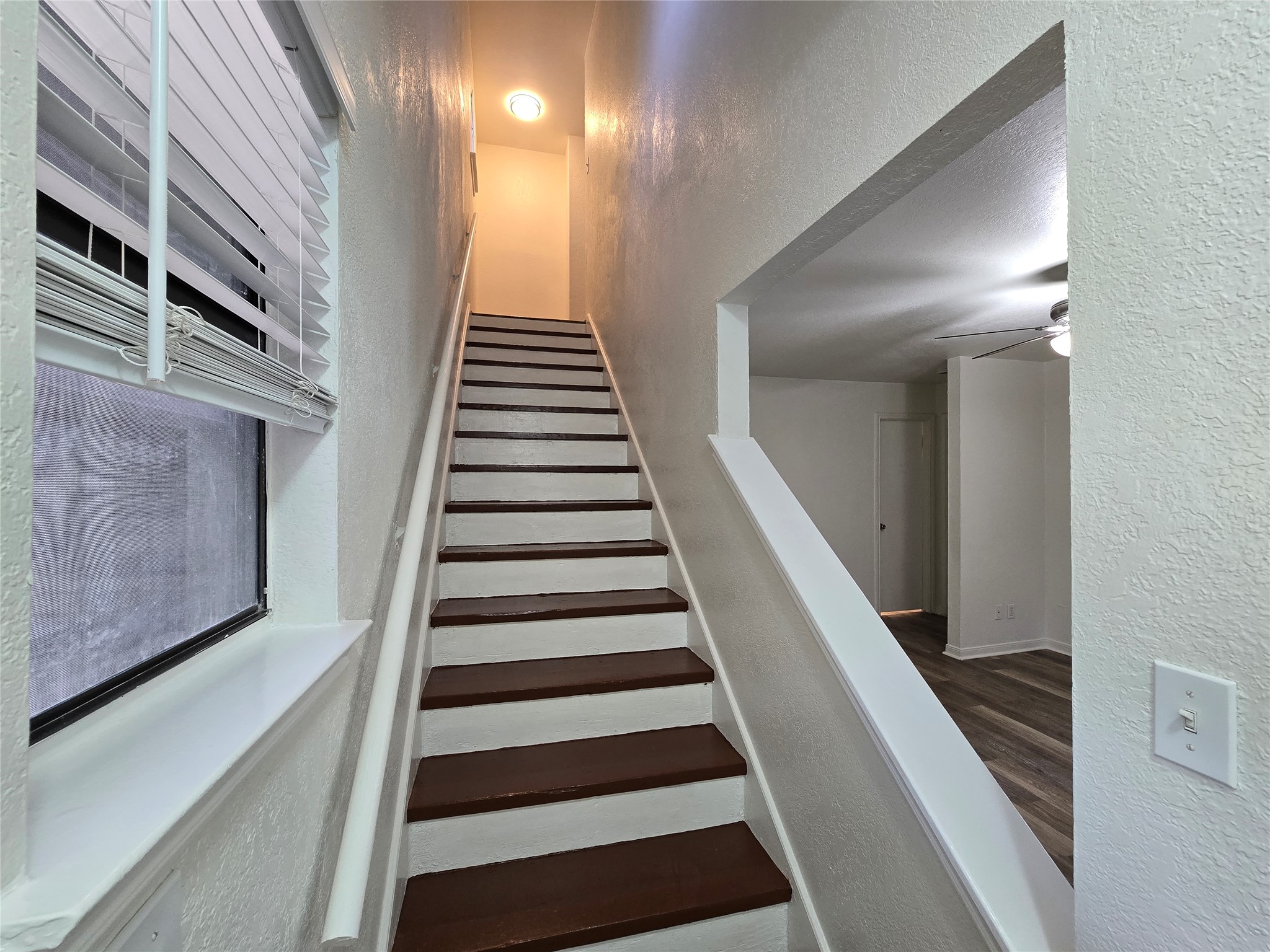 2003 Kenneth Avenue, Unit B Austin, TX 78741 - Photo 9 of 19 An open stairway with contrasting treads connects the levels of this well-lit home.