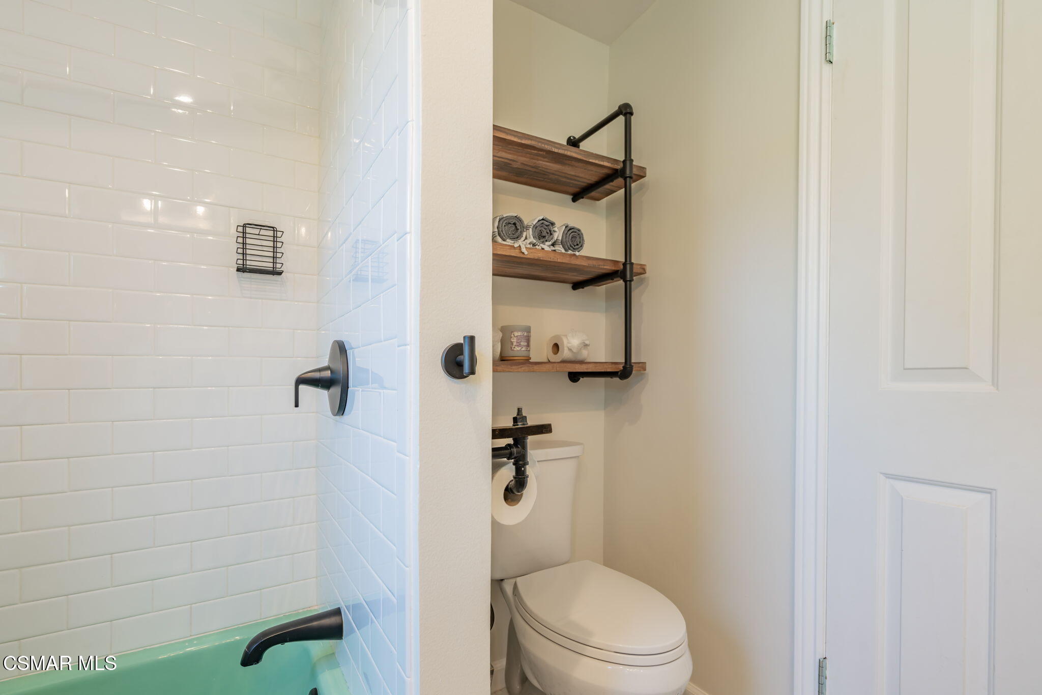 4310 Eve Road Simi Valley, CA 93063 - Photo 28 of 50 a white toilet sitting next to a shower