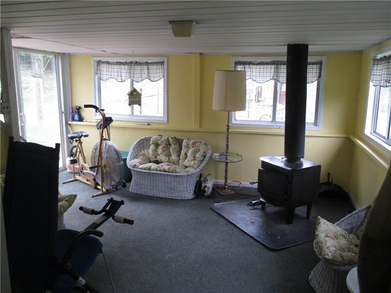 3534 Olivet Road Avonmore, PA 15618 - Photo 11 of 22 SUNROOM WITH WOOD STOVE