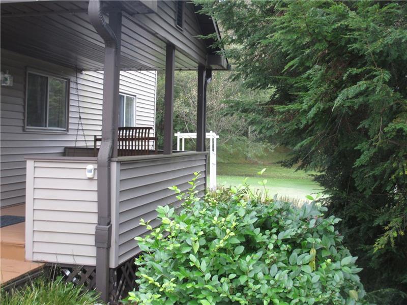 3534 Olivet Road Avonmore, PA 15618 - Photo 22 of 22 FRONT PORCH WITH SWING