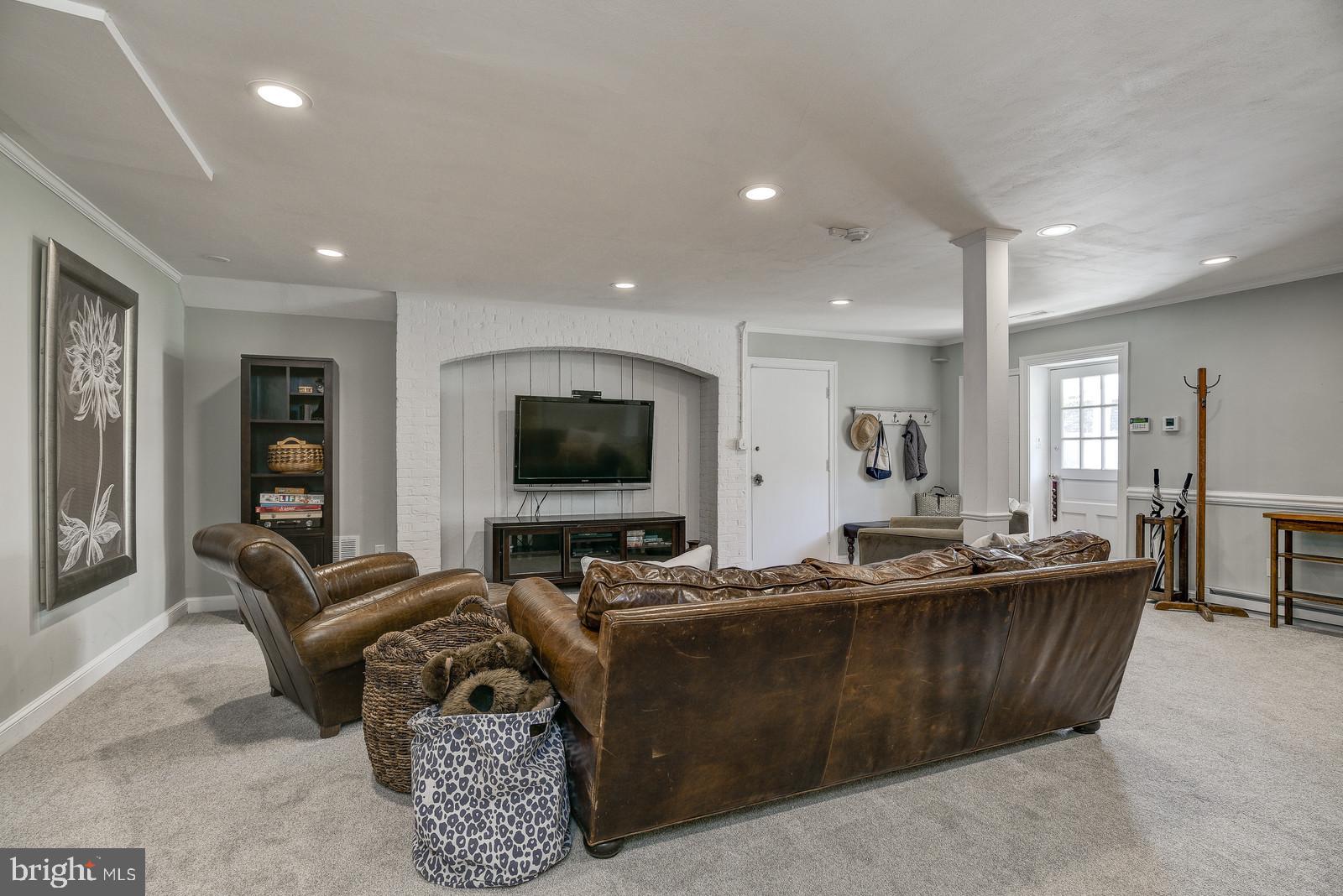 8206 Burning Tree Road Bethesda, MD 20817 - Photo 22 of 37 Lwr lvl rec room w/access to front ext & garage