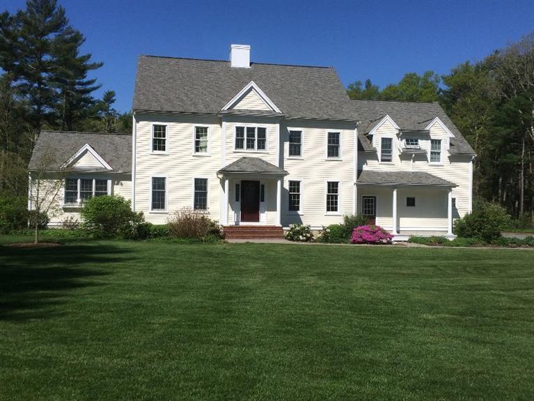 104 Paradise Lane Rochester, MA 02770 - Photo 1 of 15 a front view of a house with a garden