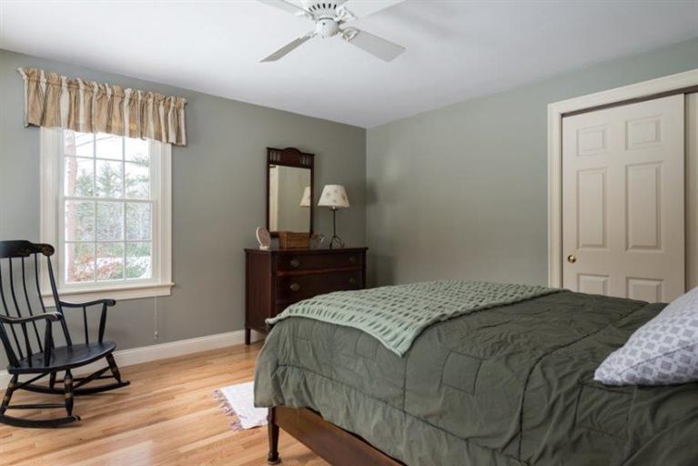104 Paradise Lane Rochester, MA 02770 - Photo 12 of 15 a bedroom with a bed windows and a window