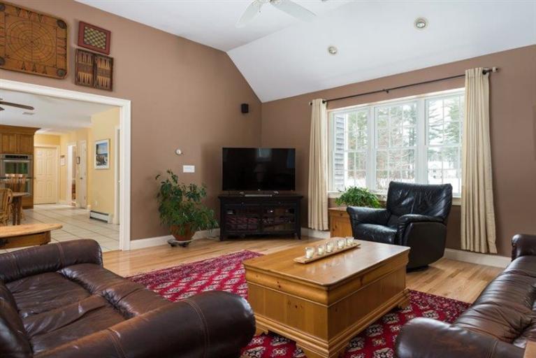 104 Paradise Lane Rochester, MA 02770 - Photo 8 of 15 a living room with furniture and a flat screen tv