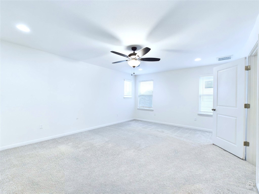 10817 Timber Brook Pass Austin, TX 78747 - Photo 14 of 23 an empty room with fan and windows