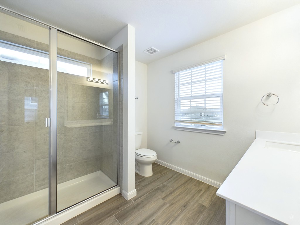 10817 Timber Brook Pass Austin, TX 78747 - Photo 16 of 23 a bathroom with a shower and a toilet