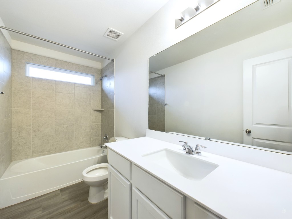 10817 Timber Brook Pass Austin, TX 78747 - Photo 21 of 23 a bathroom with a sink toilet and shower