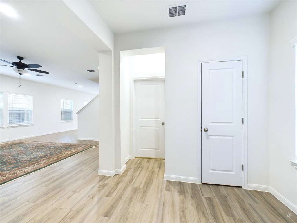 10817 Timber Brook Pass Austin, TX 78747 - Photo 3 of 23 a view of hallway with wooden floor