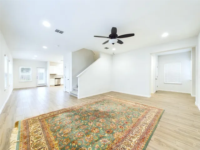 a view of a kitchen with a sink and cabinets