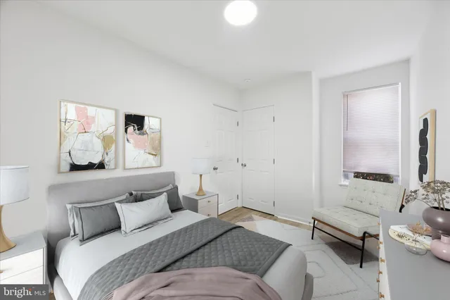 a bedroom with a bed and couch