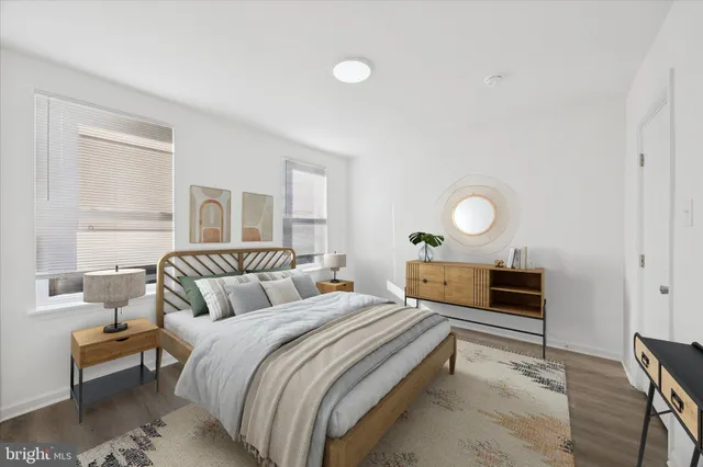 a bedroom with a bed and window