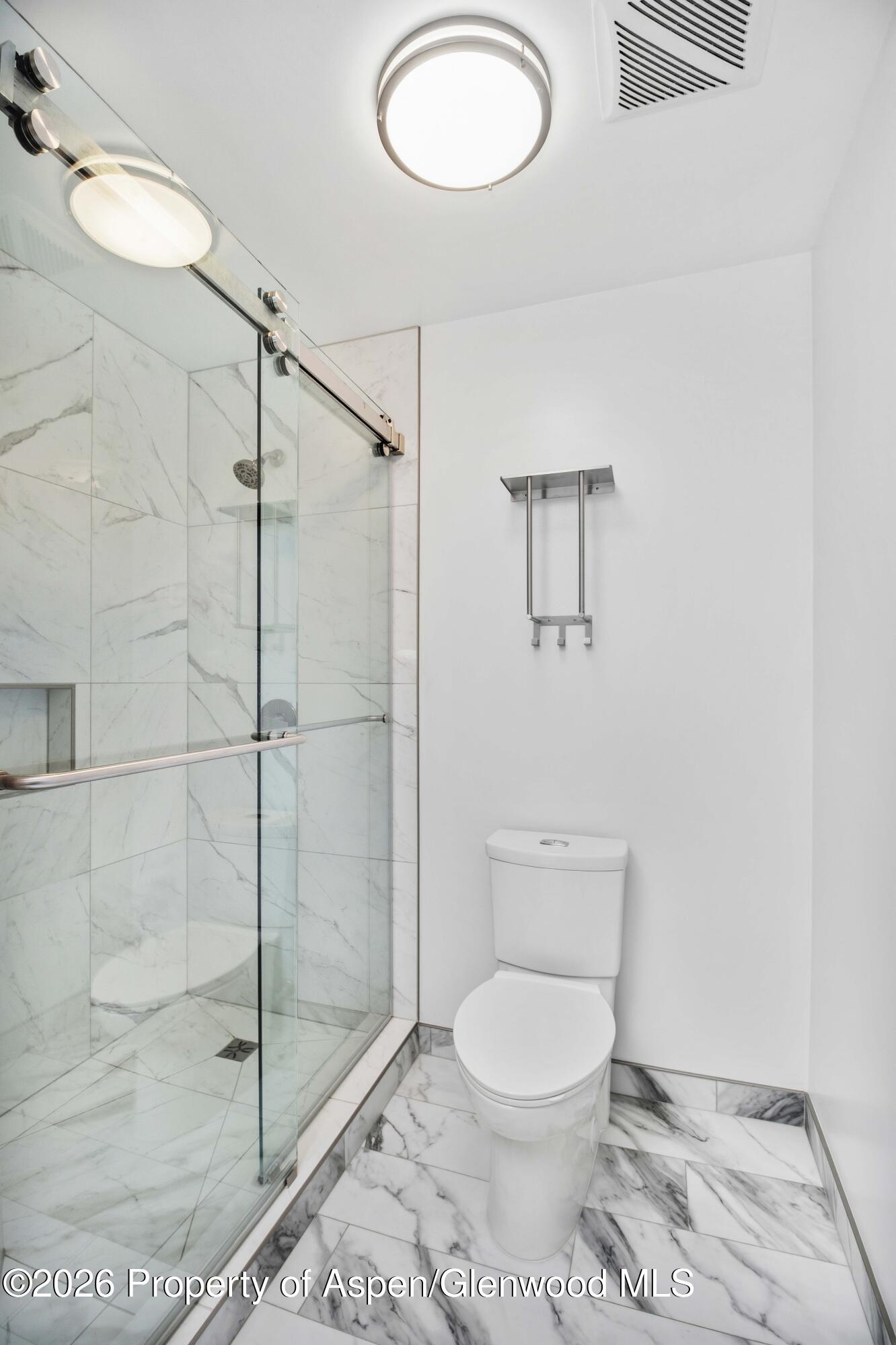 660 Aspen Avenue Rifle, CO 81650 - Photo 13 of 30 a bathroom with a toilet and a shower