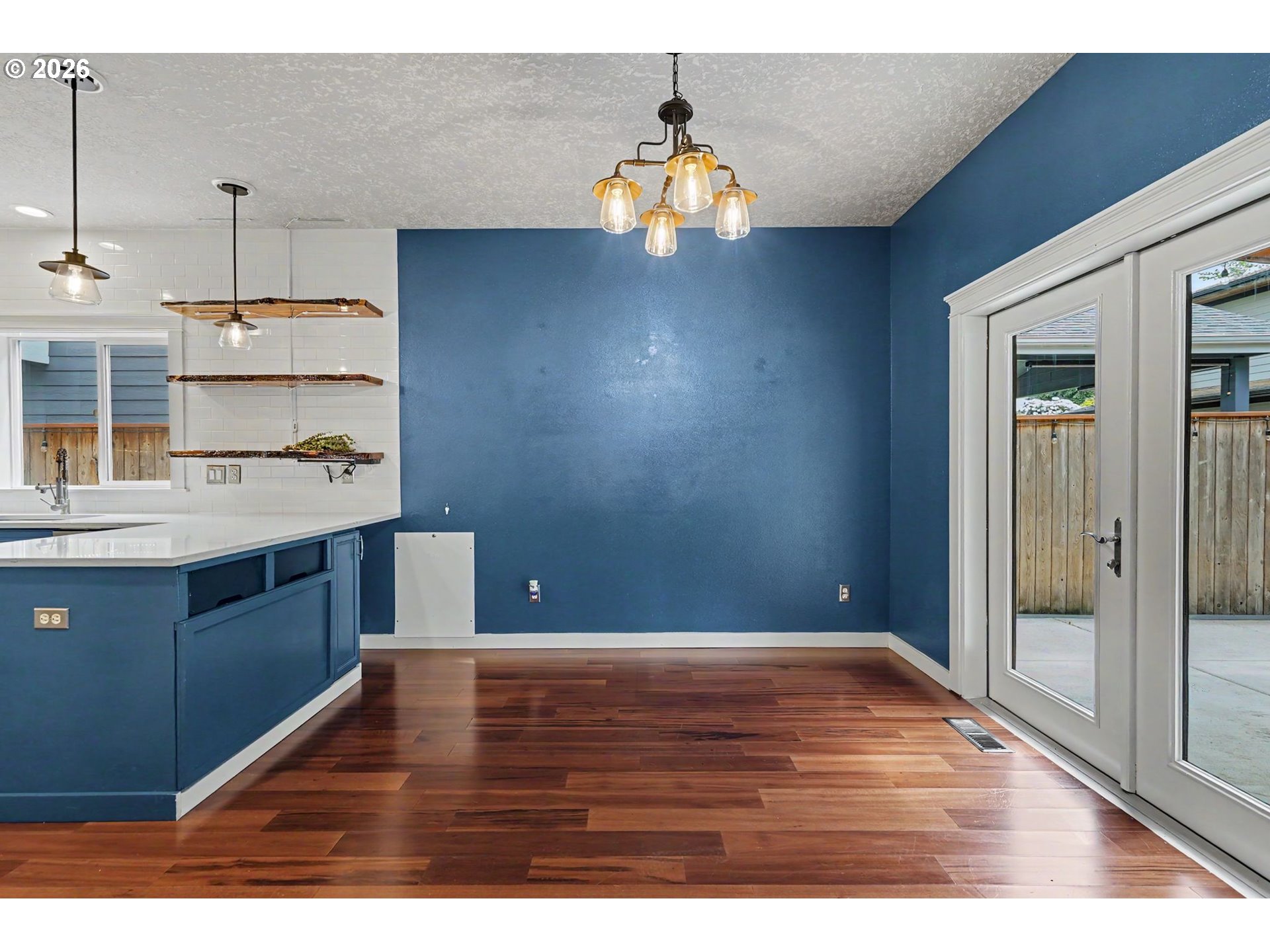 1462 Barnick Road Northeast Keizer, OR 97303 - Photo 15 of 48 a kitchen with kitchen island a sink stove and wooden floor