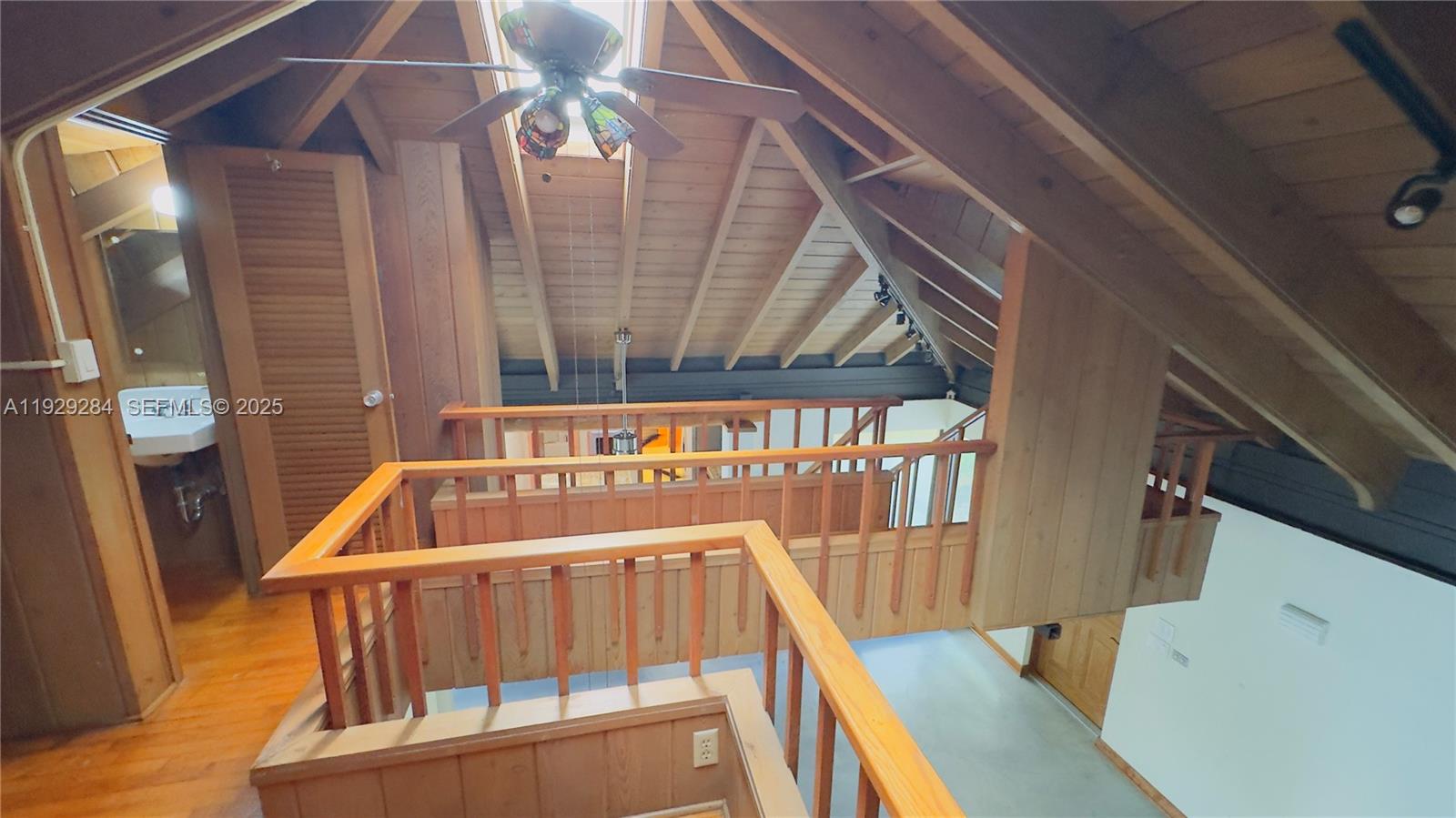 18350 Southwest 214th Street Miami, FL 33187 - Photo 15 of 24 a view of staircase with a small stove