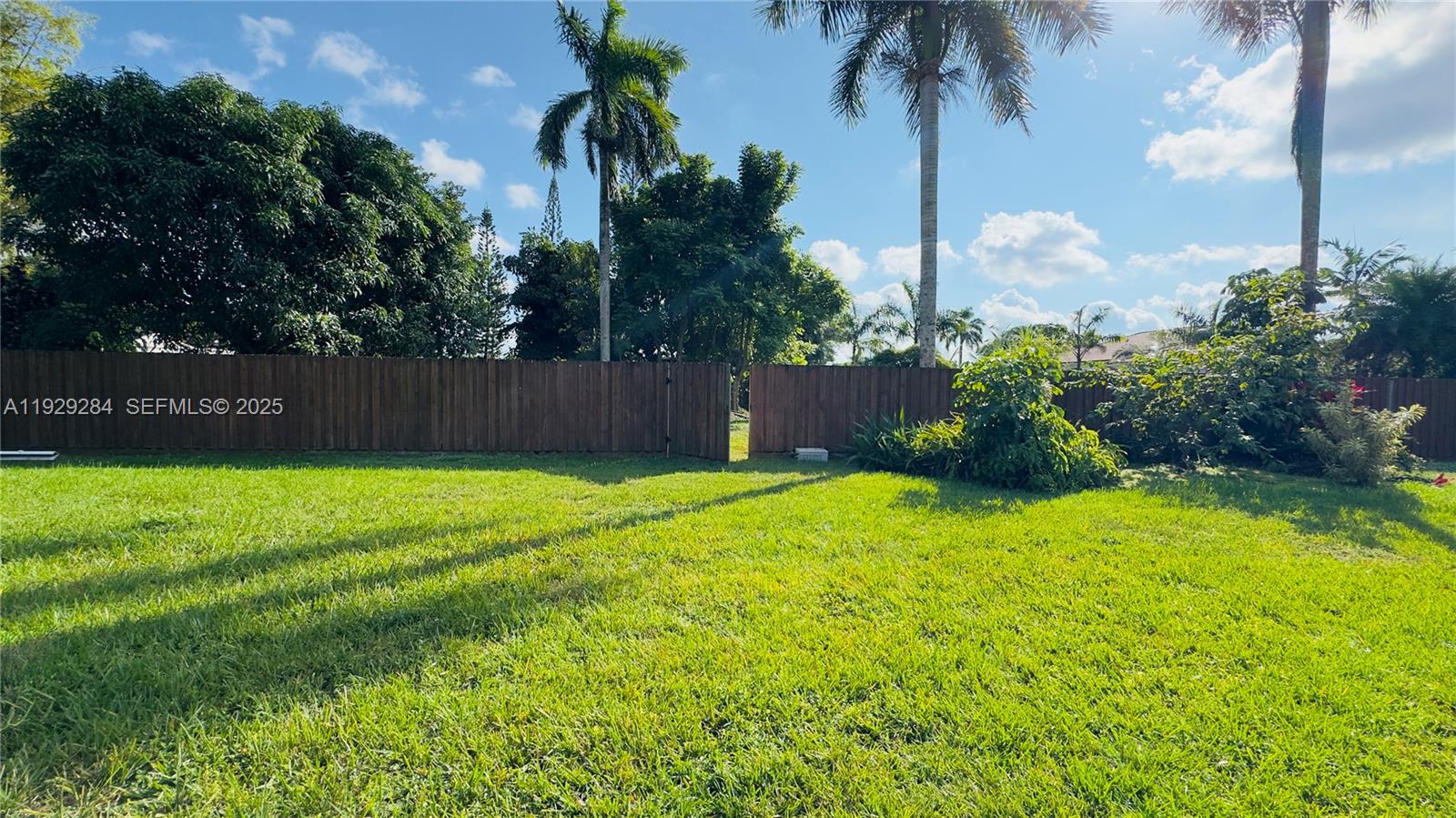 18350 Southwest 214th Street Miami, FL 33187 - Photo 22 of 24 a swimming pool with outdoor seating and yard
