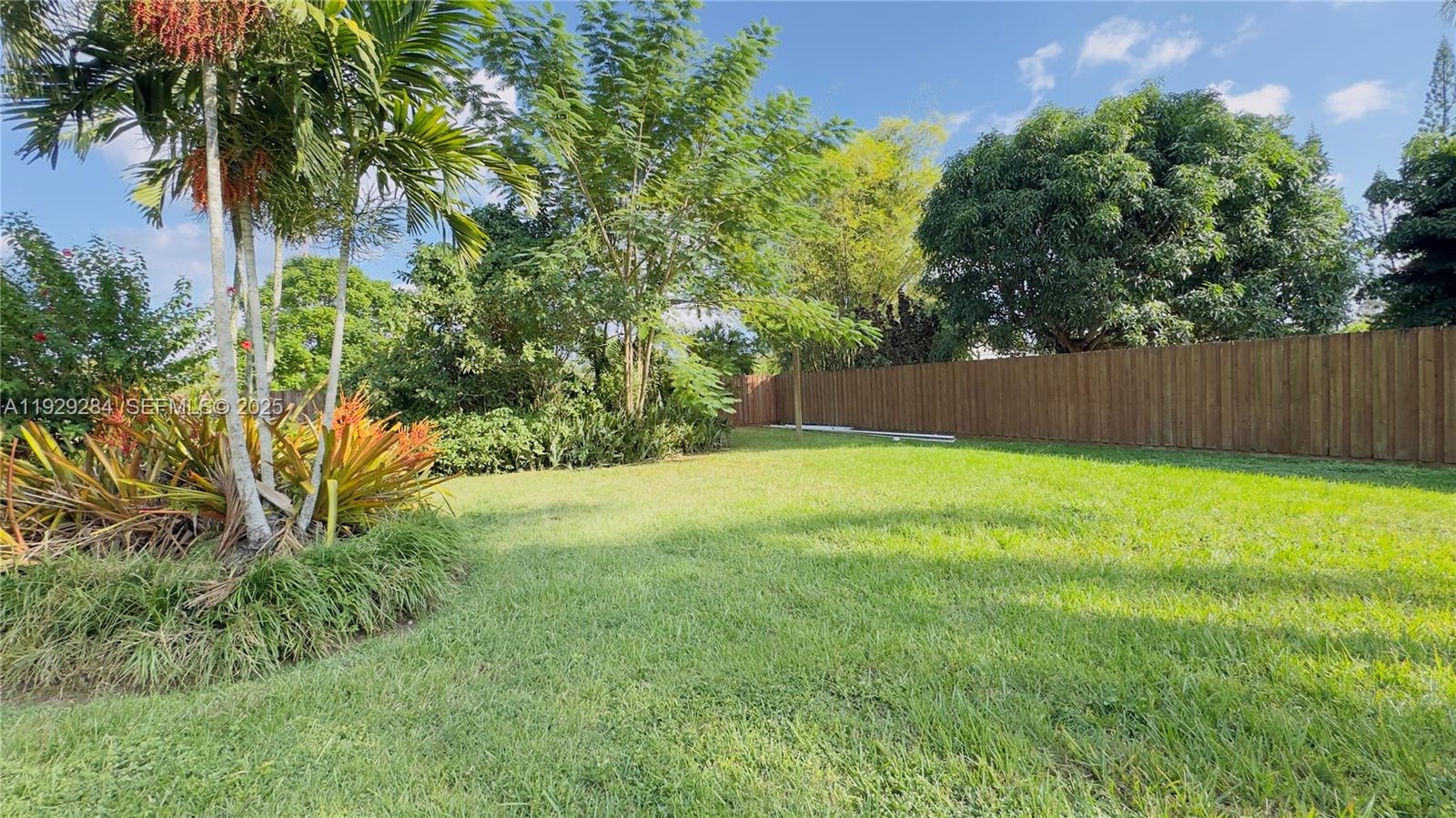 18350 Southwest 214th Street Miami, FL 33187 - Photo 23 of 24 a swimming pool with wooden fence