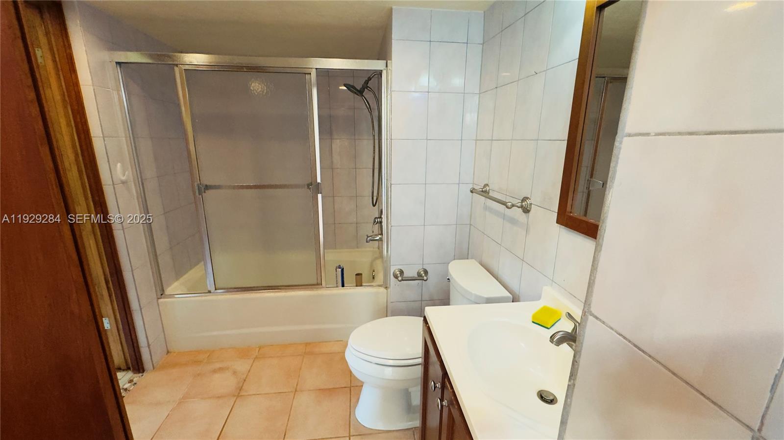 18350 Southwest 214th Street Miami, FL 33187 - Photo 6 of 24 a bathroom with a toilet and a shower