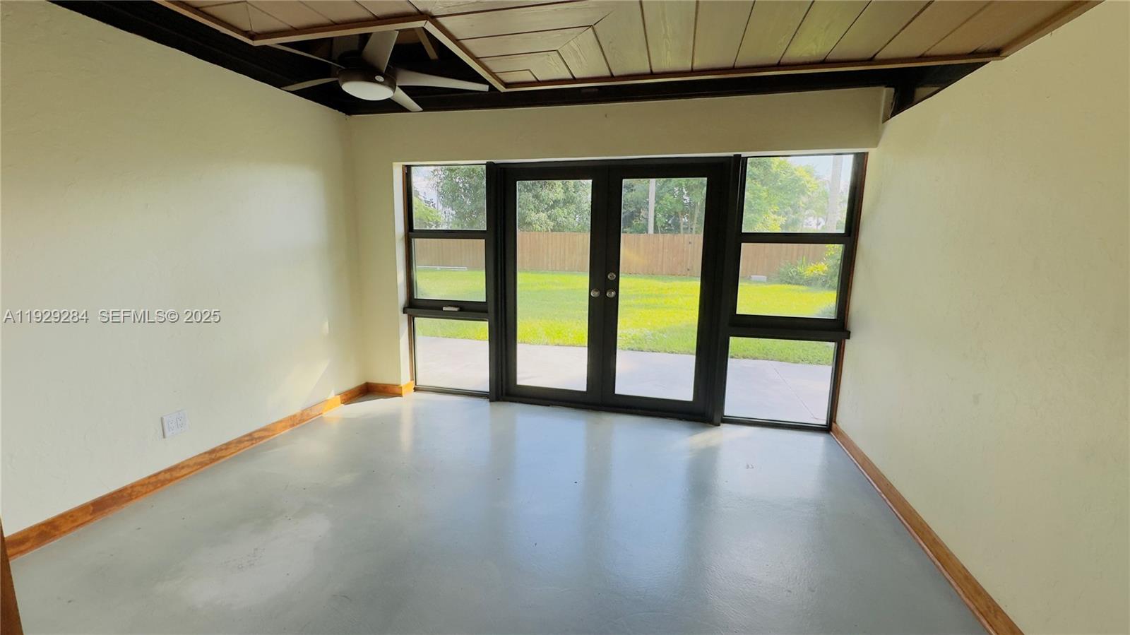 18350 Southwest 214th Street Miami, FL 33187 - Photo 7 of 24 a view of an empty room with a window