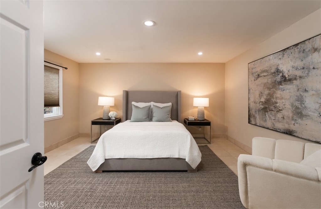 10282 Ambervale Lane North Tustin, CA 92705 - Photo 34 of 41 a bedroom with a bed and a couch