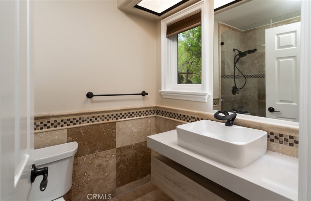 10282 Ambervale Lane North Tustin, CA 92705 - Photo 35 of 41 a bathroom with a sink and a mirror