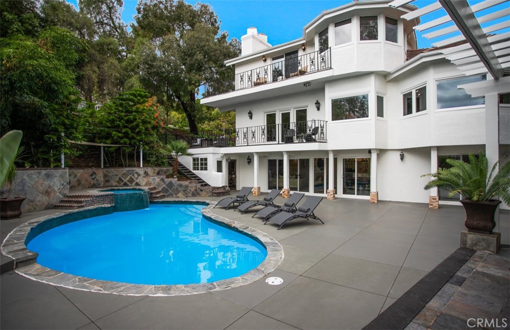 10282 Ambervale Lane North Tustin, CA 92705 - Photo 38 of 41 a view of a house with pool fire pit and chairs in front of main door