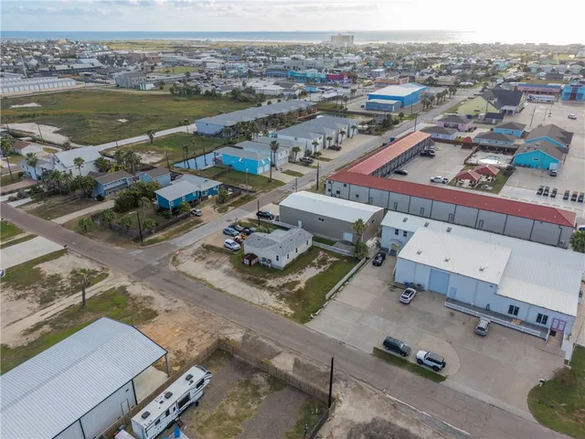 an aerial view of a city with ocean view