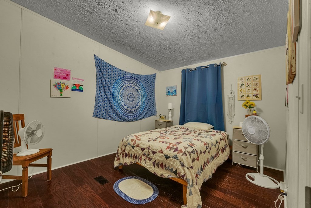 170 Perrigan Lane Sparta, TN 38583 - Photo 10 of 27 a bedroom with a bed and a table in it