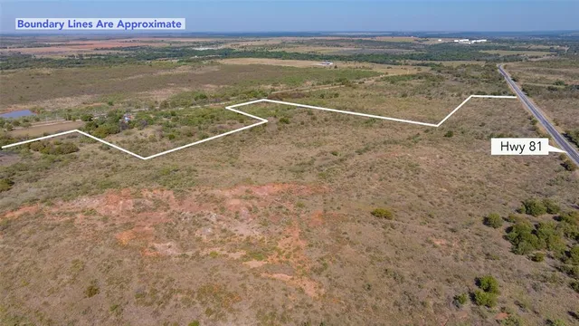 a view of a dry yard with mountain
