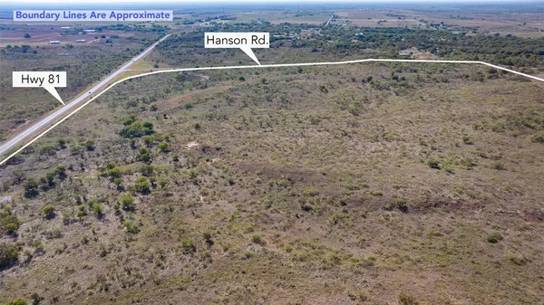 a view of a field with an ocean