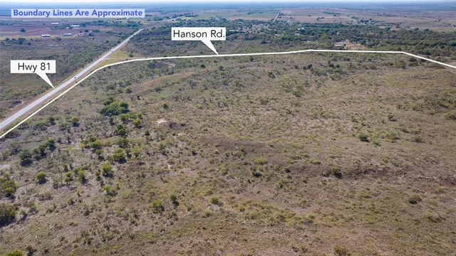 a view of a field with an ocean