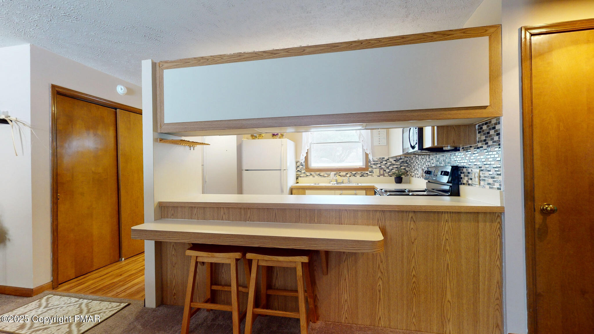 130 Foxfire Drive, Unit 103 Mount Pocono, PA 18344 - Photo 11 of 38 a kitchen with a sink and a window