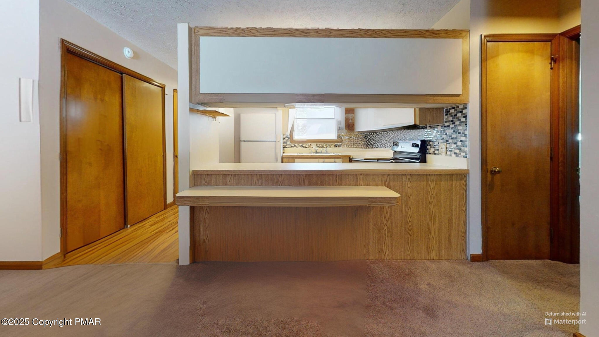 130 Foxfire Drive, Unit 103 Mount Pocono, PA 18344 - Photo 12 of 38 a view of cabinet and kitchen view