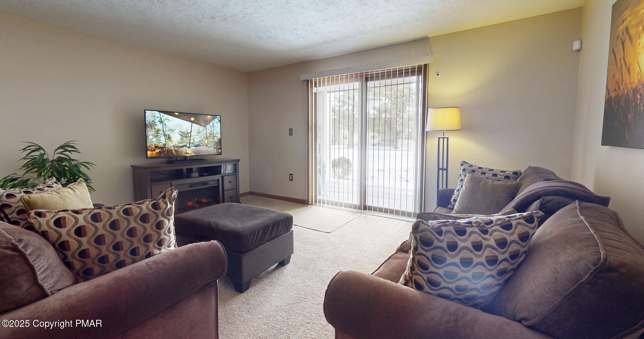 130 Foxfire Drive, Unit 103 Mount Pocono, PA 18344 - Photo 21 of 38 a living room with furniture or couch and a flat screen tv