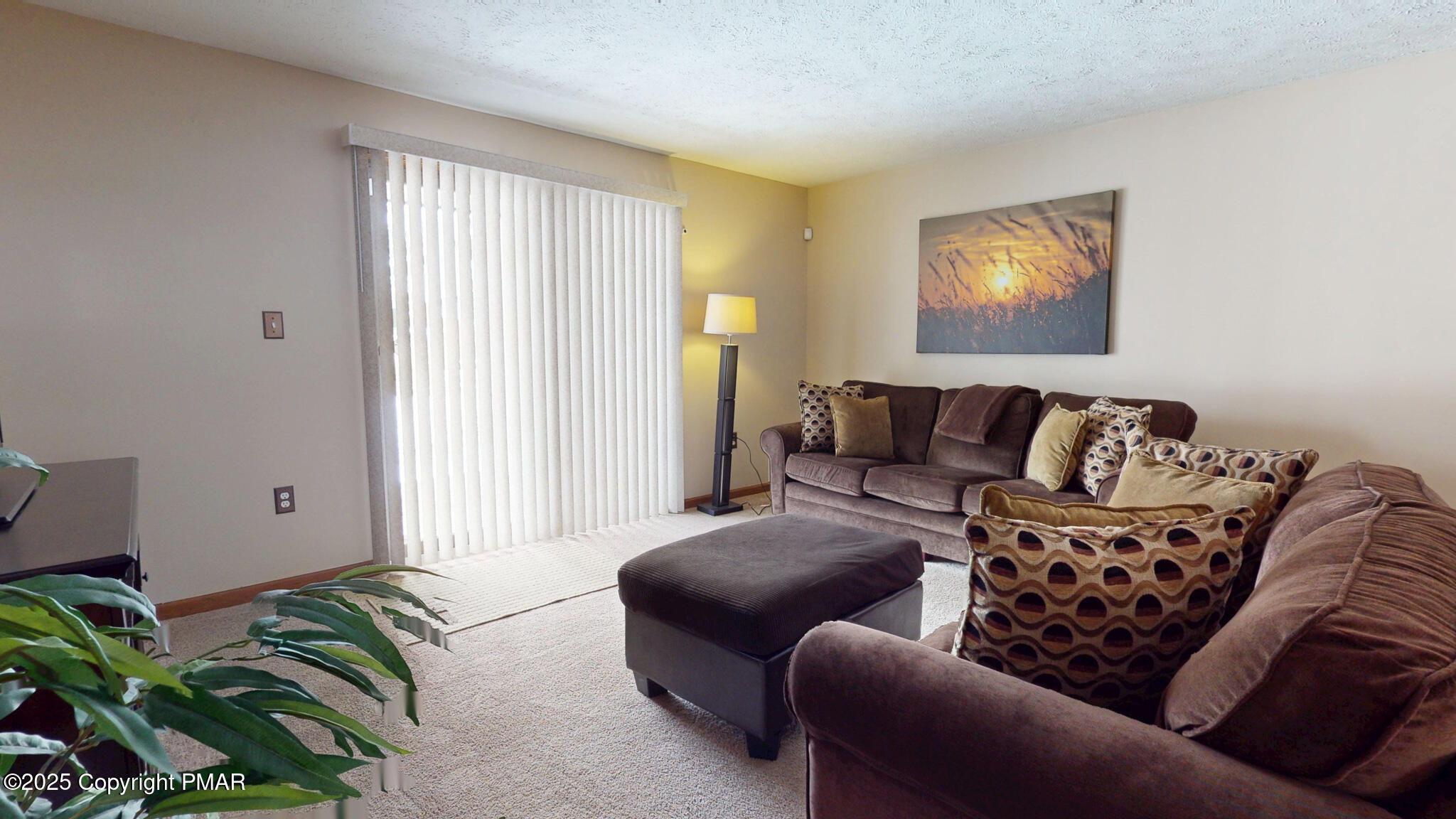 130 Foxfire Drive, Unit 103 Mount Pocono, PA 18344 - Photo 22 of 38 a living room with furniture and a potted plant