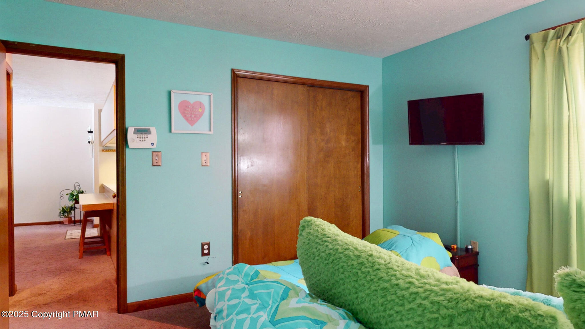 130 Foxfire Drive, Unit 103 Mount Pocono, PA 18344 - Photo 27 of 38 a living room with furniture and a gate