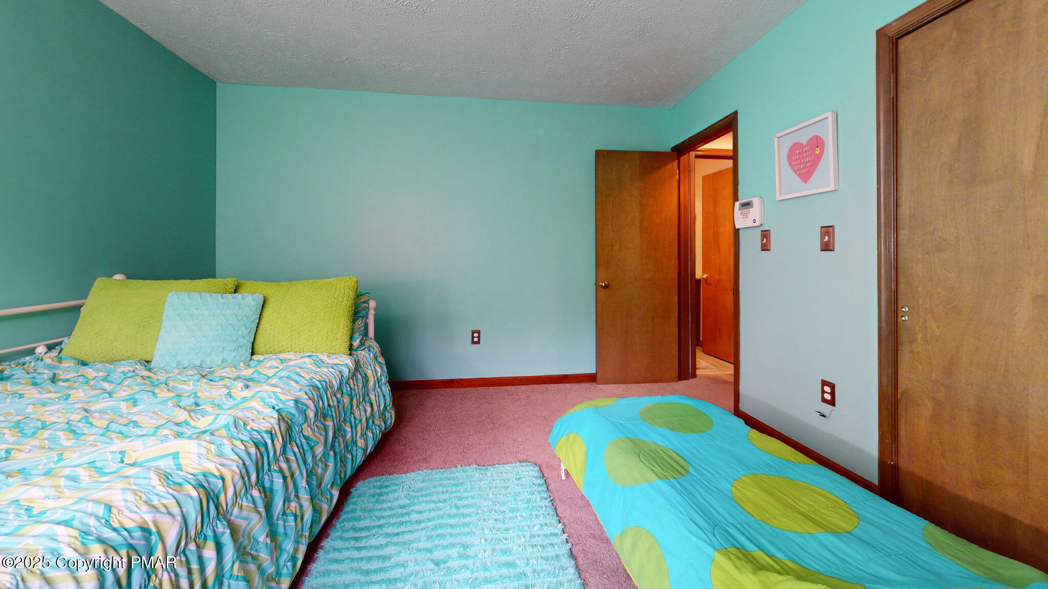 130 Foxfire Drive, Unit 103 Mount Pocono, PA 18344 - Photo 28 of 38 a bedroom with a bed and a couch