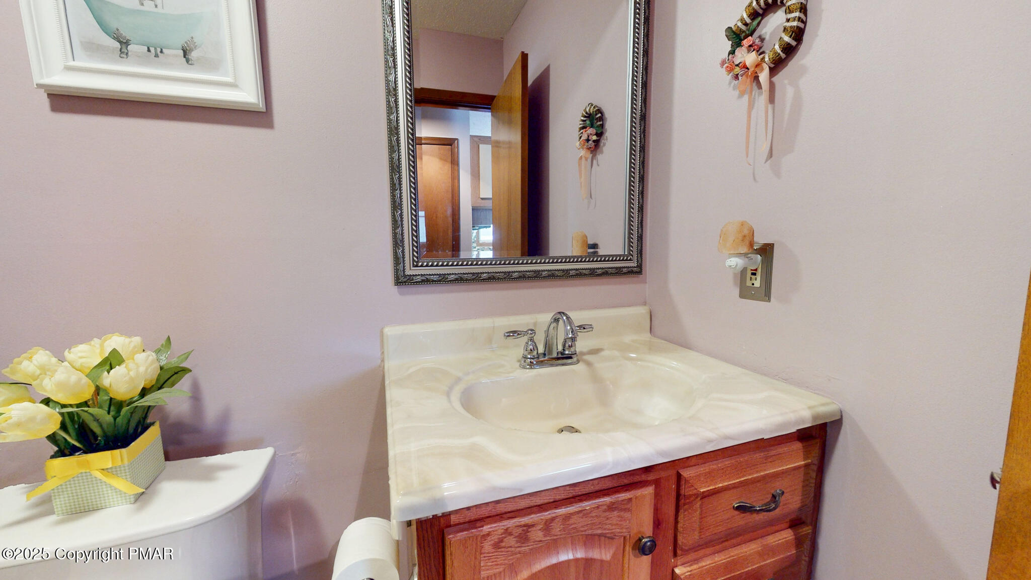 130 Foxfire Drive, Unit 103 Mount Pocono, PA 18344 - Photo 32 of 38 a bathroom with a sink and a mirror