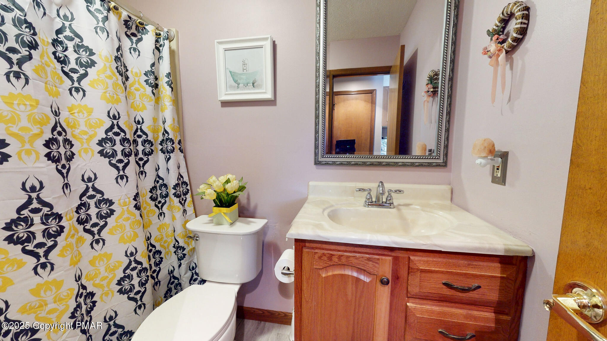 130 Foxfire Drive, Unit 103 Mount Pocono, PA 18344 - Photo 33 of 38 a bathroom with a sink and a mirror