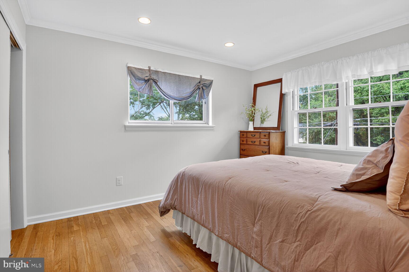 4618 Twinbrook Road Fairfax, VA 22032 - Photo 14 of 24 a bedroom with a bed and a large window