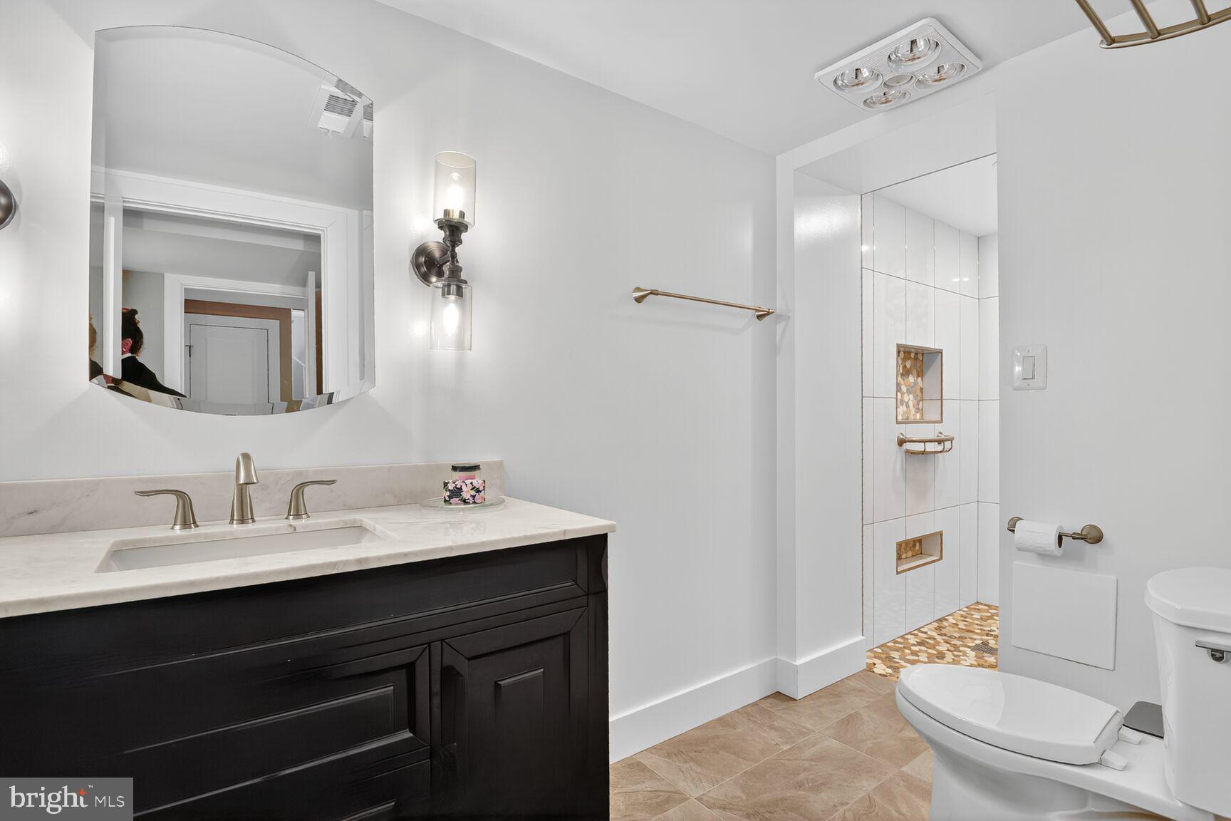 4618 Twinbrook Road Fairfax, VA 22032 - Photo 20 of 24 a bathroom with a sink and a mirror