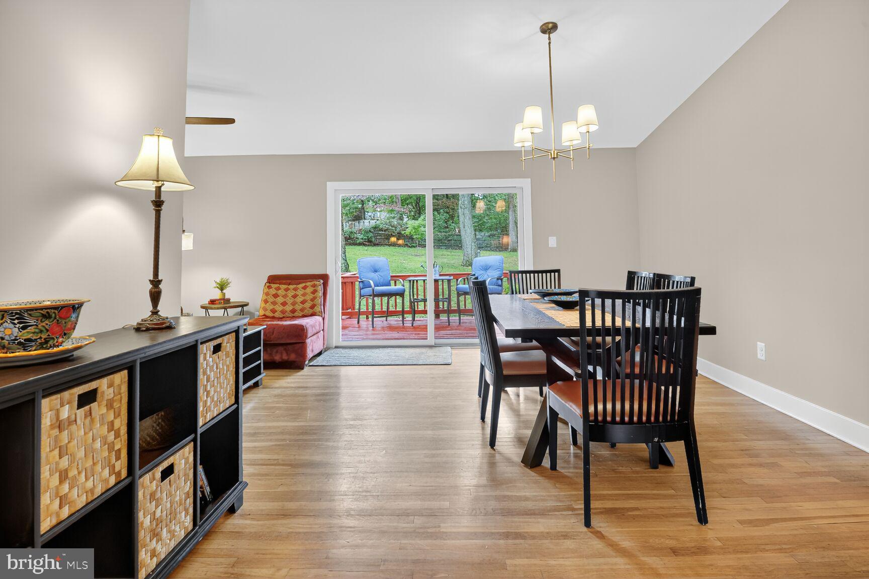 4618 Twinbrook Road Fairfax, VA 22032 - Photo 2 of 24 a dining room with furniture a chandelier and wooden floor