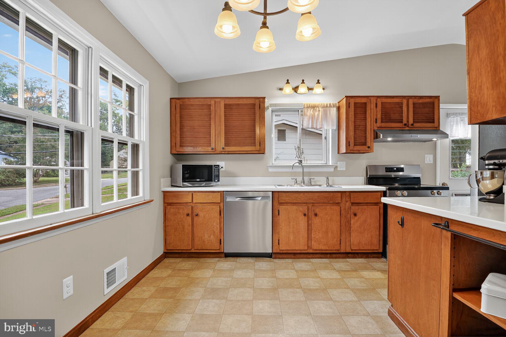 4618 Twinbrook Road Fairfax, VA 22032 - Photo 5 of 24 a large kitchen with stainless steel appliances granite countertop a stove and a sink