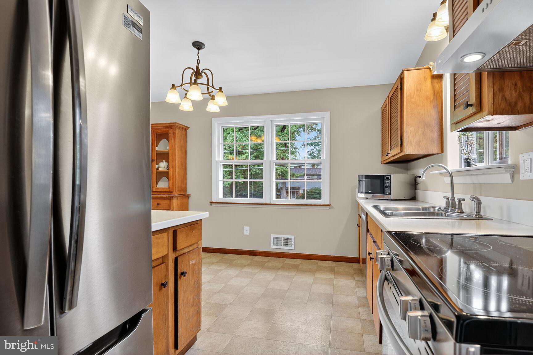 4618 Twinbrook Road Fairfax, VA 22032 - Photo 8 of 24 a view of a kitchen with a sink and dishwasher