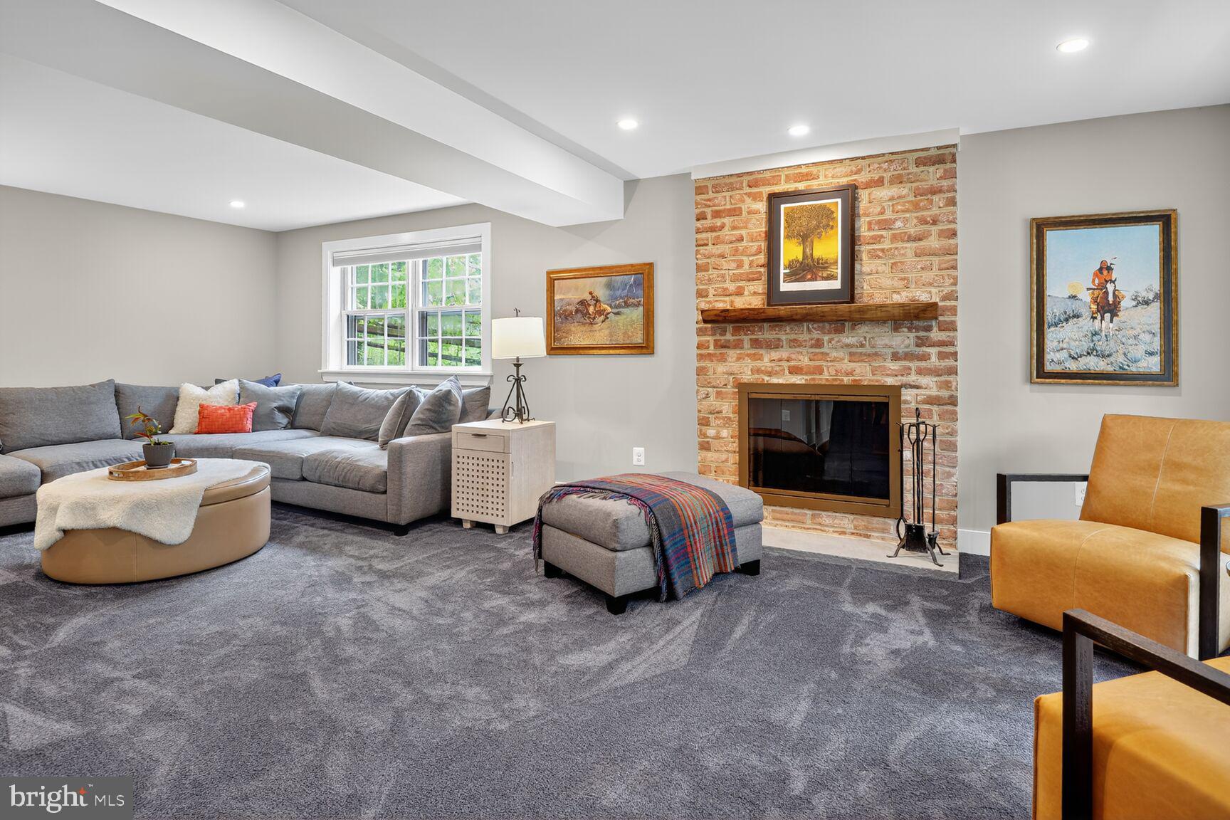 4618 Twinbrook Road Fairfax, VA 22032 - Photo 10 of 24 a living room with furniture and a fireplace