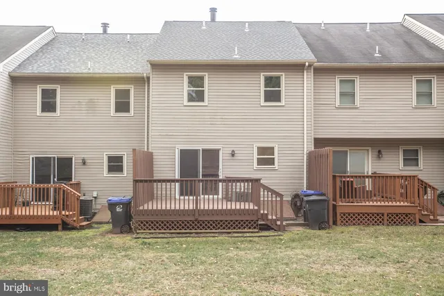 a view of a house with a yard and a large window
