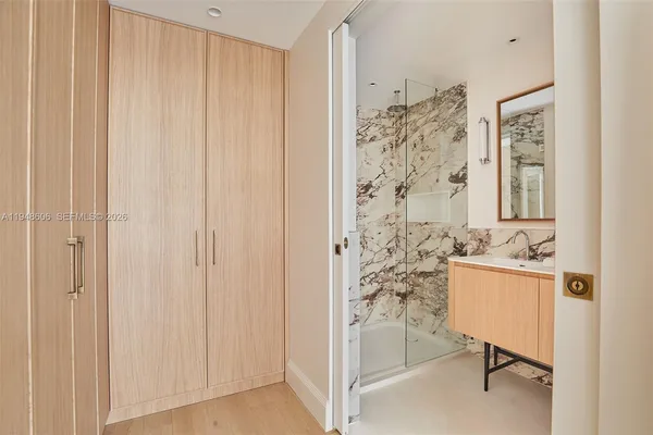 a bathroom with a shower curtain and a window