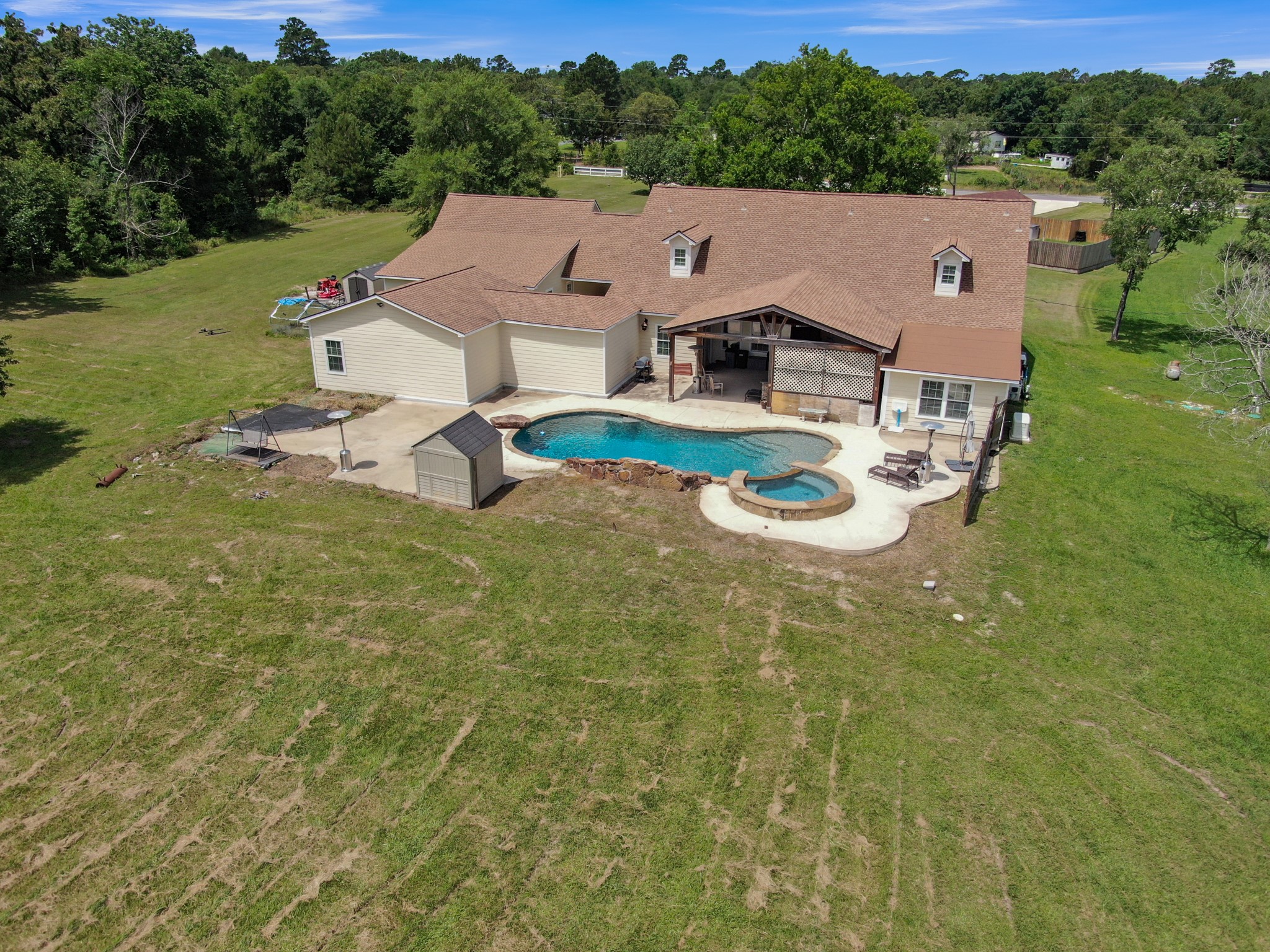 144 Wood Farm Road Huntsville, TX 77320 - Photo 31 of 35 a aerial view of a house with pool garden and trees